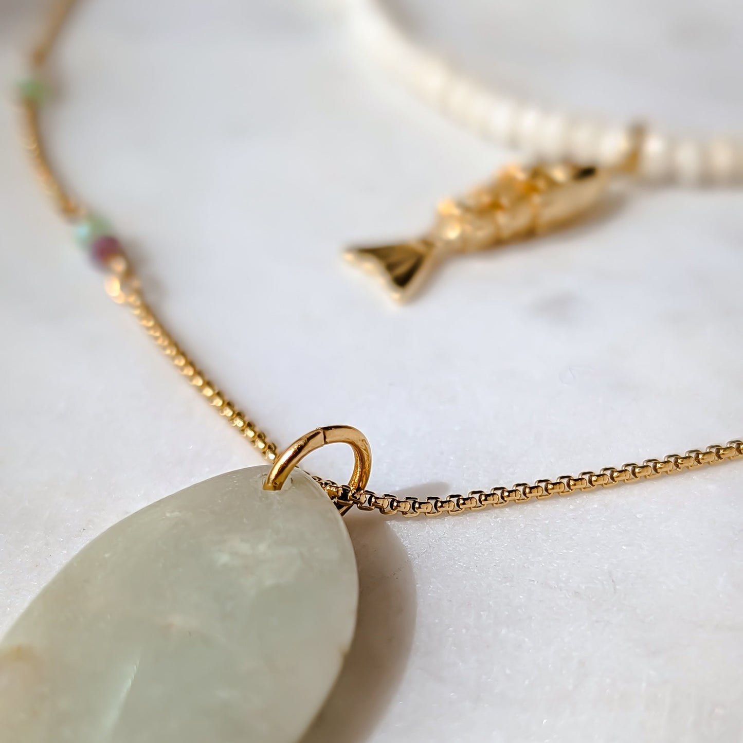 Necklace with a jade pendant on a white background