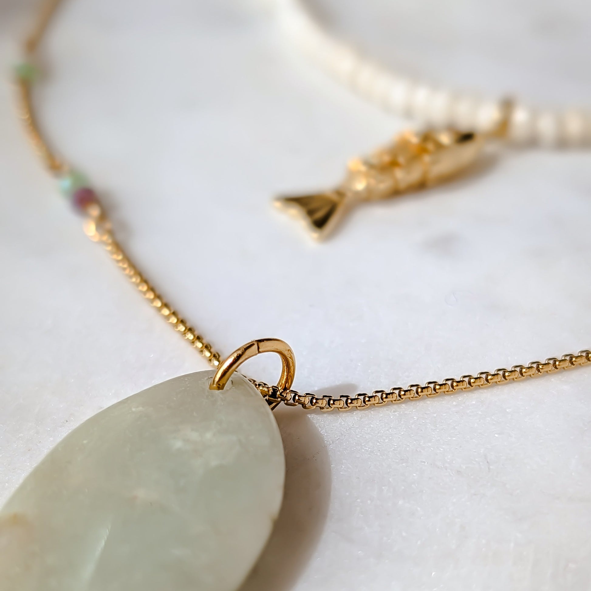 Necklace with a jade pendant on a white background